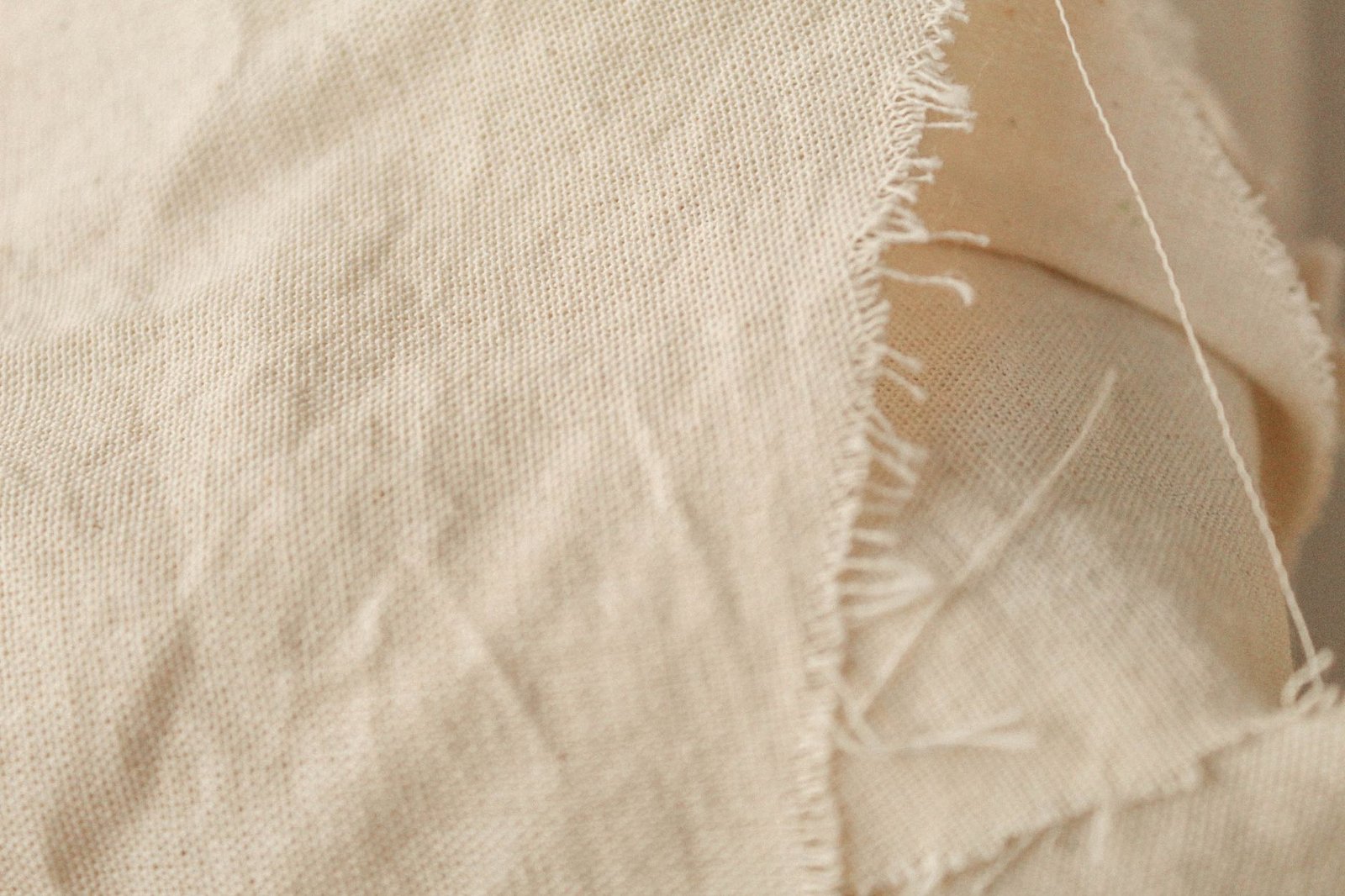 Canvas fabric being sewn into a sturdy bag