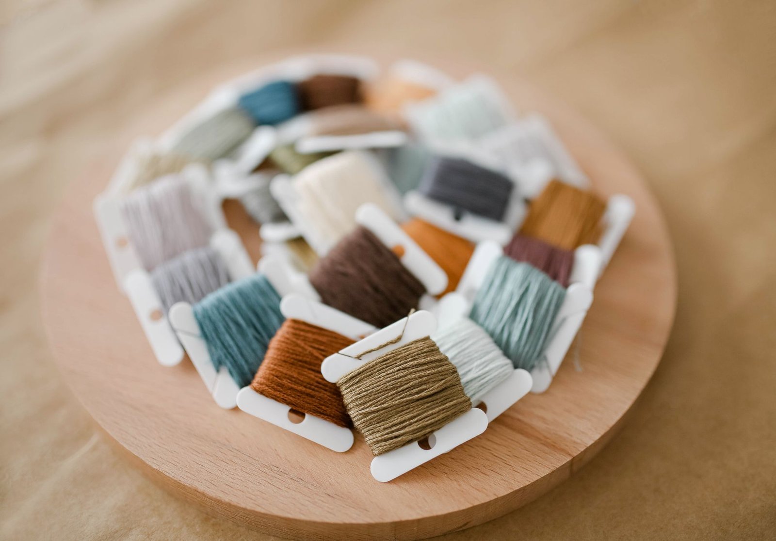 Embroidery floss wound onto bobbins and organized by color for cross stitch
