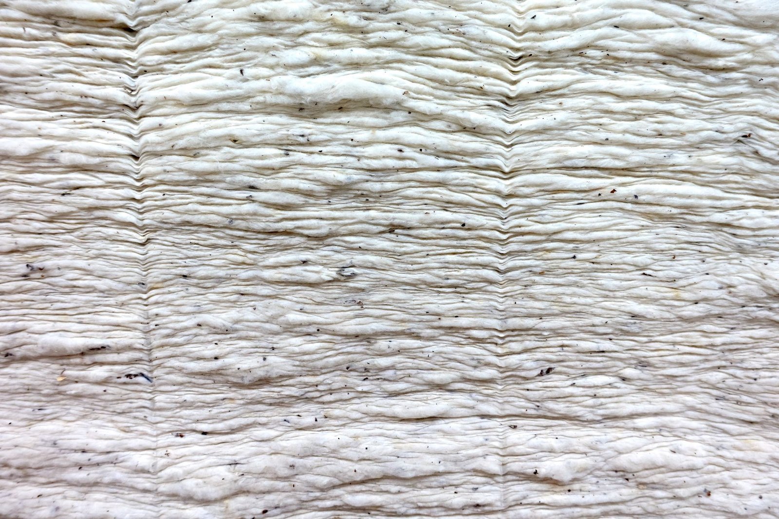 Layers of soft raw insulated batting fabric
