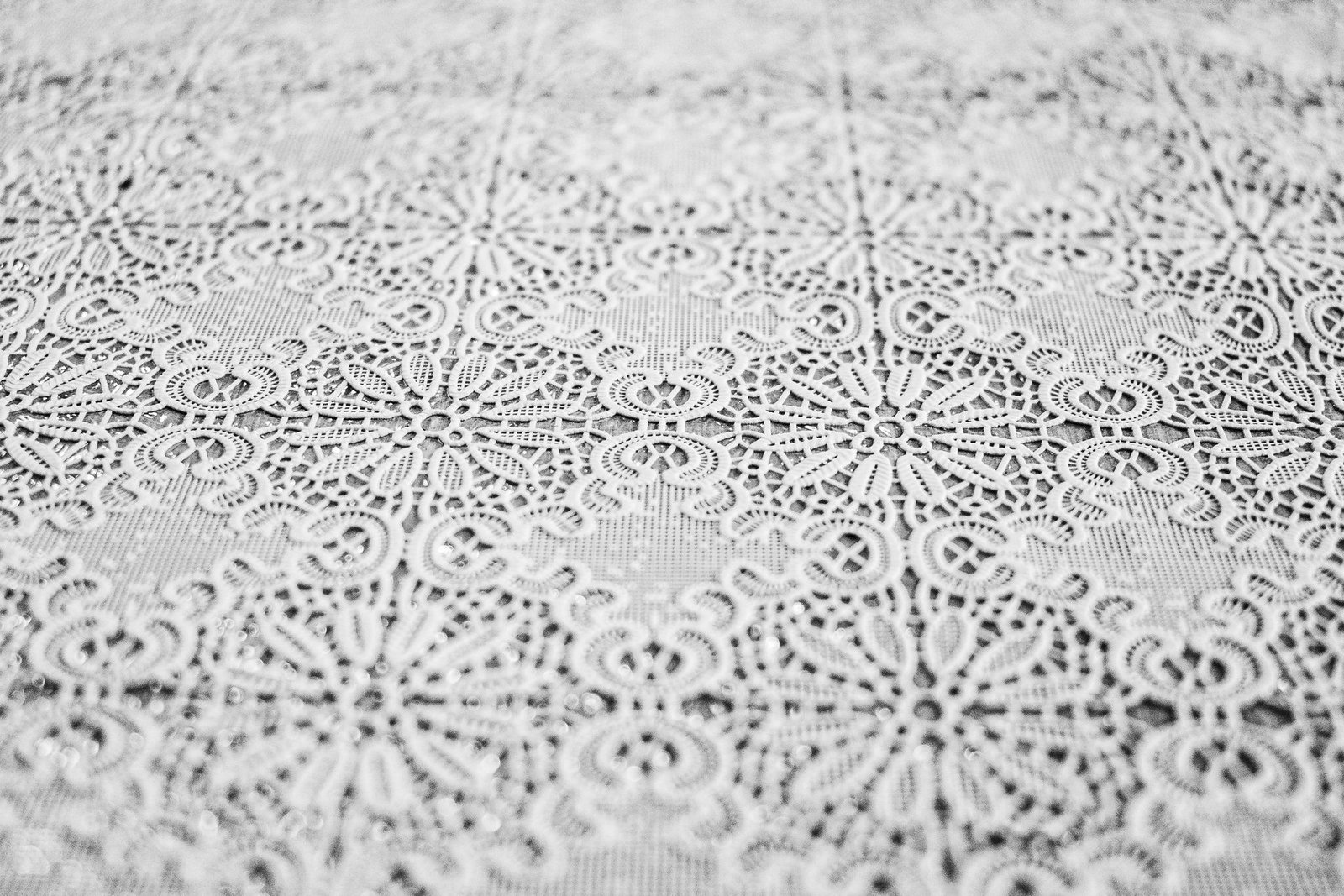 Macro view of intricate floral lace fabric pattern