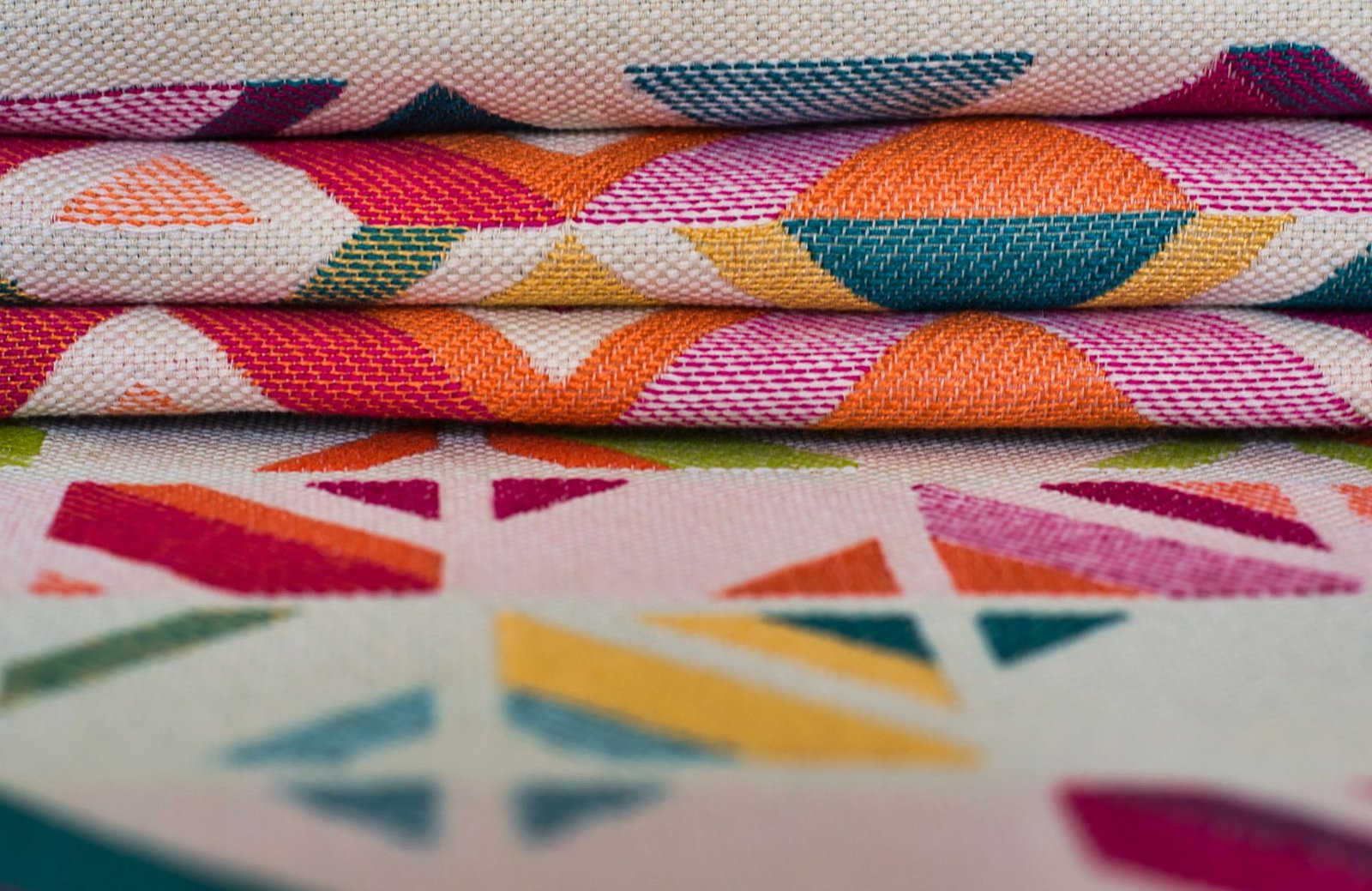 Close-up of a brightly colored printed fabric panel with geometric patterns