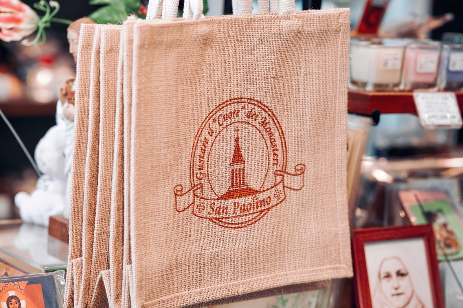 Natural burlap jute tote bags displayed at a market stall