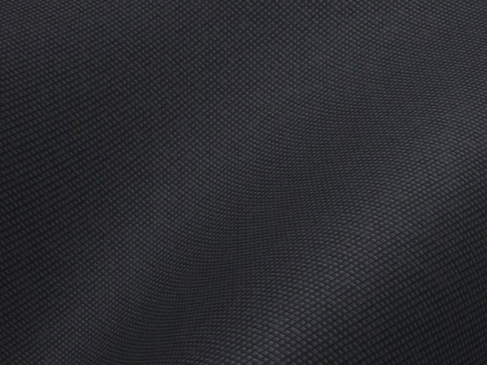Close-up of dark fabric showing a fine woven grid texture similar to ripstop