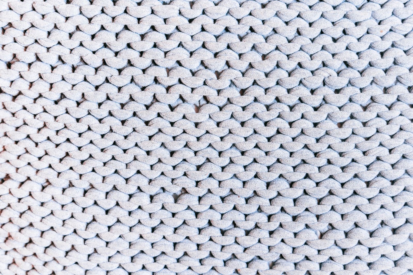 Close-up of smooth interlock knit fabric showing its identical double-knit surface