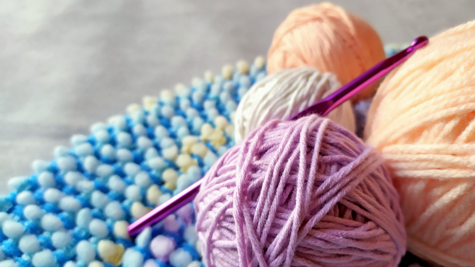 Colorful yarn used for a punch needle embroidery craft project