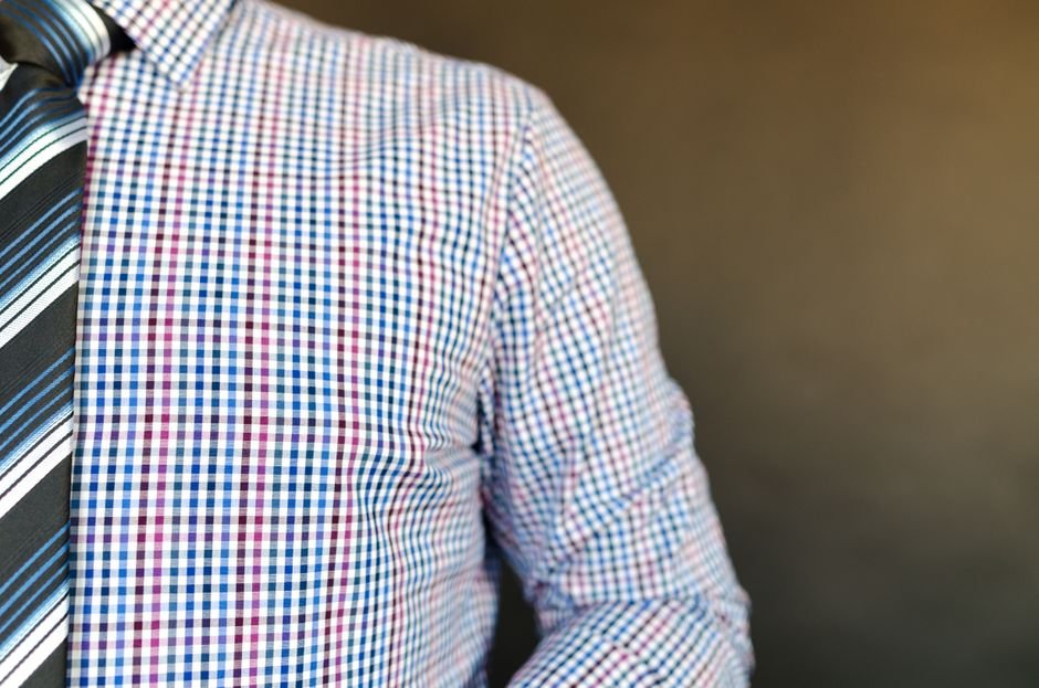 Blue and pink micro-check gingham fabric showing a soft nursery-friendly colorway
