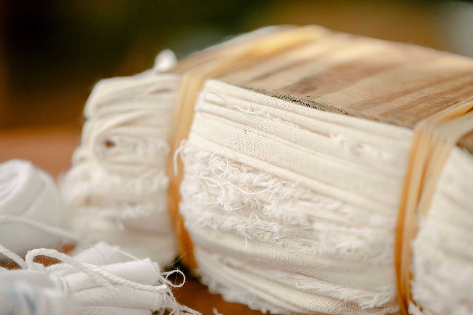 Neatly folded cream bias tape strips bundled together