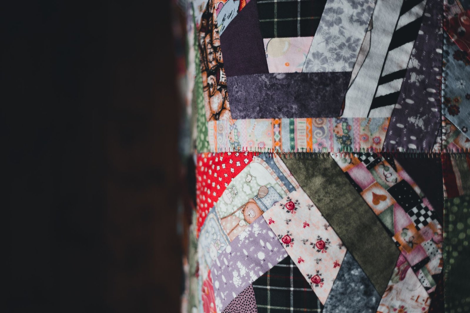 Colorful irregular patchwork quilt pieced at random angles