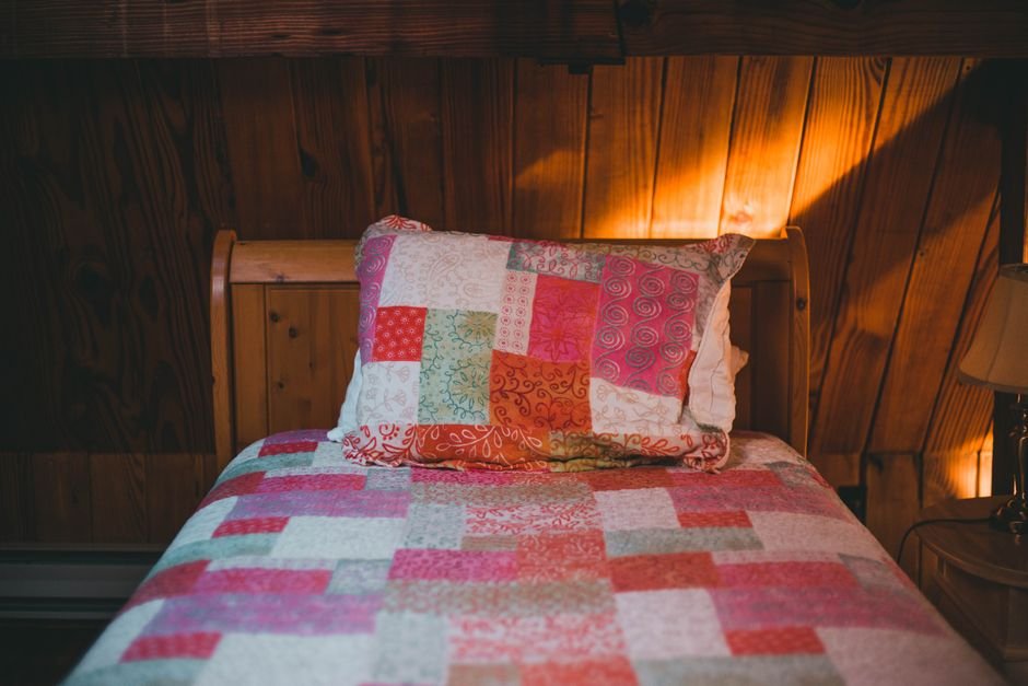 Forest cabin themed quilting fabric bolt showing a nature-inspired print