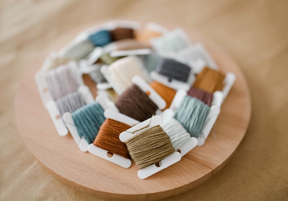 Detailed cross stitch pattern with multiple floss colors showing designer-level stitching detail