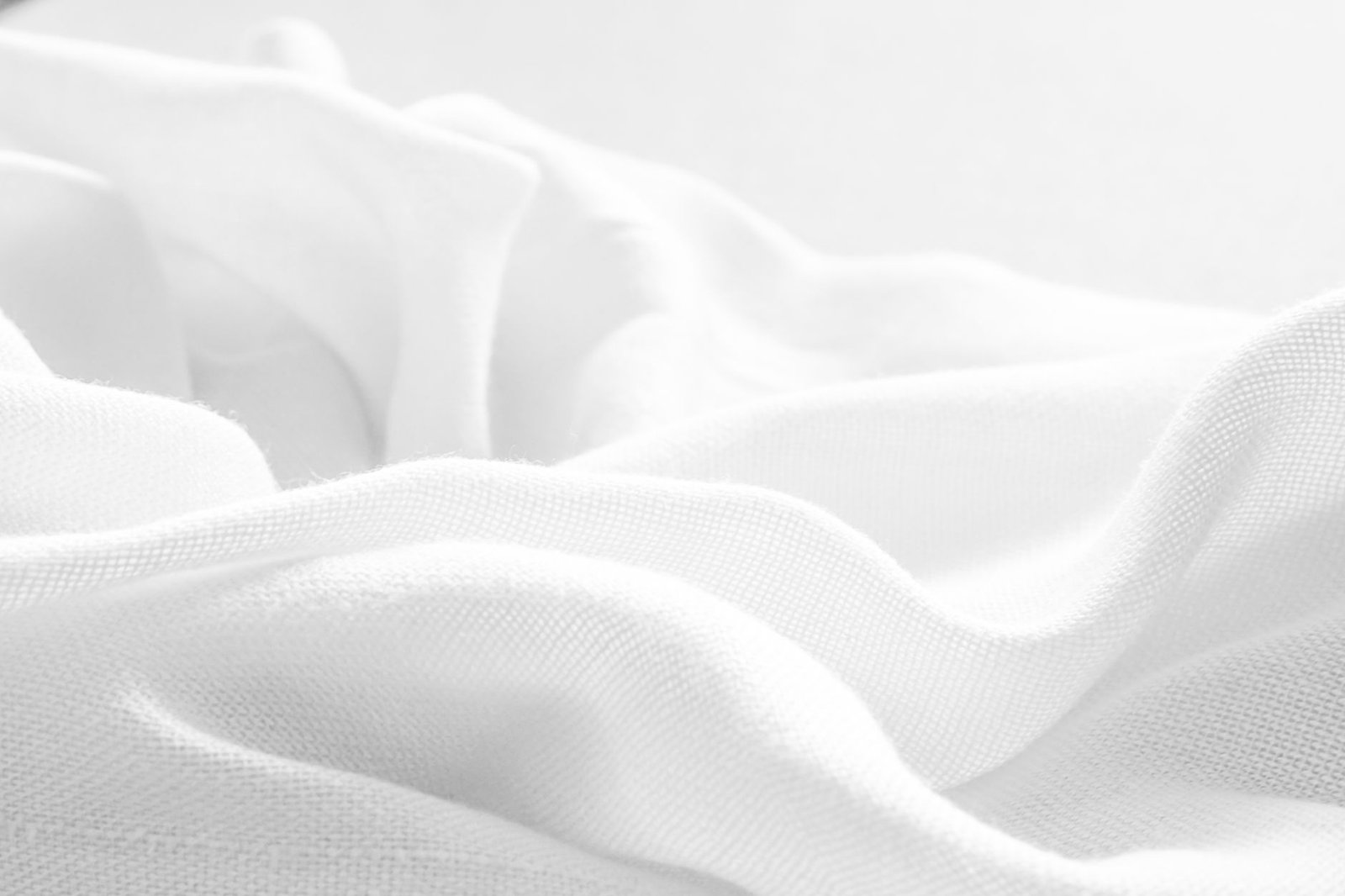 Soft white cotton gauze fabric folded and stacked