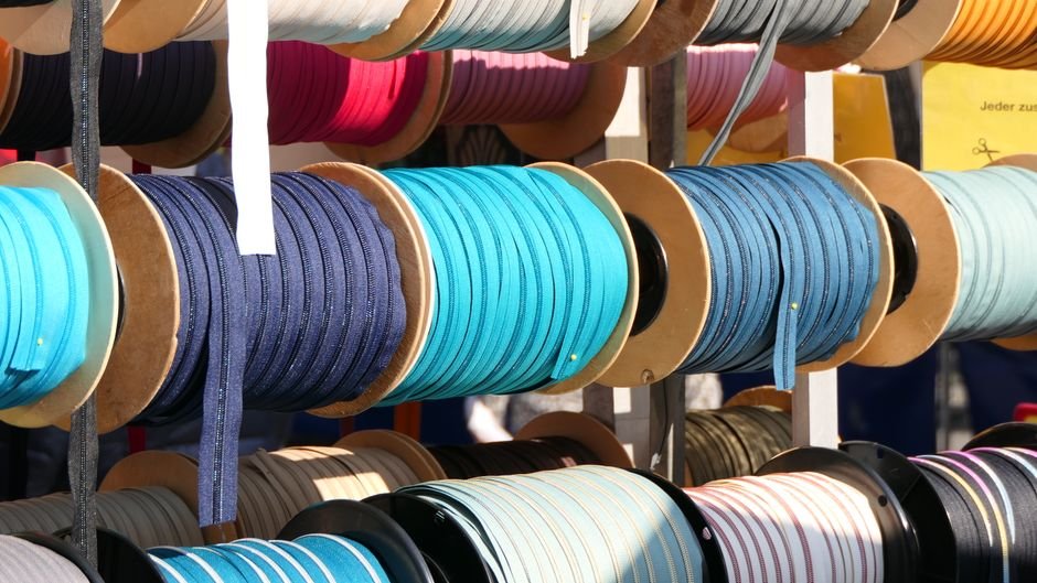 Thin coordinated fabric strips coiled together similar to a honey bun precut