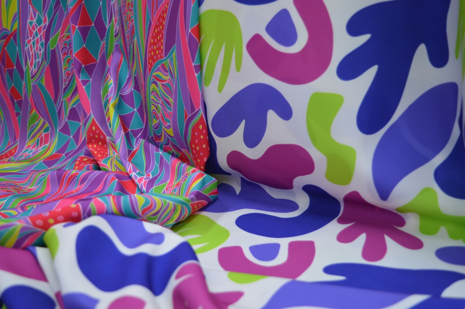 Abstract colorful cut-paper style shapes printed on fabric