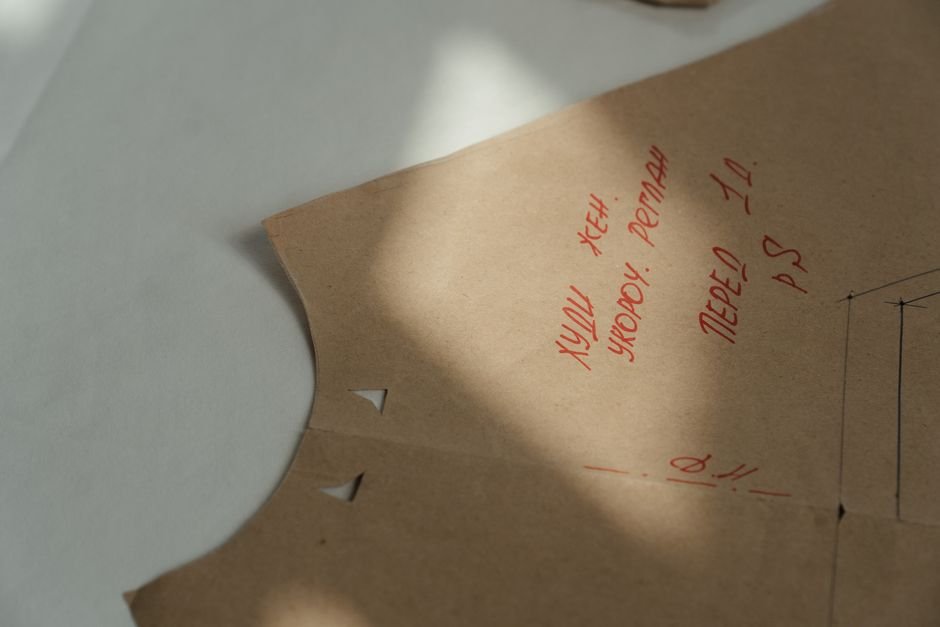 Sewing pattern paper with handwritten notes and markings